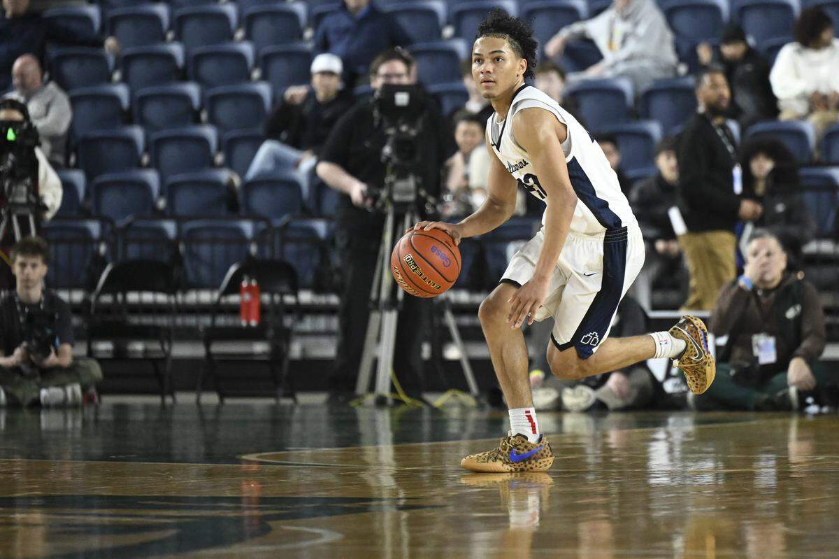 Bellarmine Prep guard Ronnie Wiggins (22) moves down the court during the quarterfinal round of the 3A State Tournament against Edmonds-Woodway at the Tacoma Dome, on Thursday, March 5, 2026, in Tacoma, Wash.