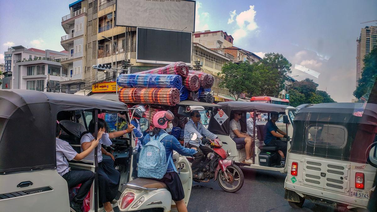 Motorists navigate a street in Phnom Penh, Cambodia on April 25, 2019.