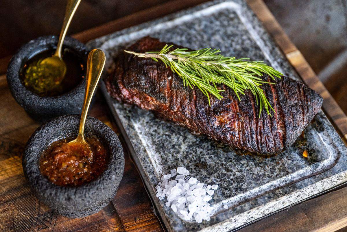 Like most of the steaks at Cuerno Bravo, the vacio, a flank cut popular in Argentina, is served on a sizzling hot stone, garnished with rosemary and salt. If instructed in full, staff advises you to move the steak to the board and lay slices back on the stone per your personal tastes.