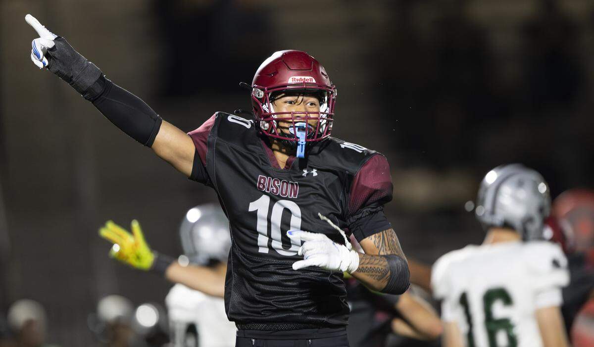 Bethel Bison linebacker Ramzak Fruean (10) reacts to a forced turnover against the Emerald Ridge Jaguars during the second half of the game at Art Crate Field on Thursday, Sept. 11, 2025, in Spanaway, Wash.