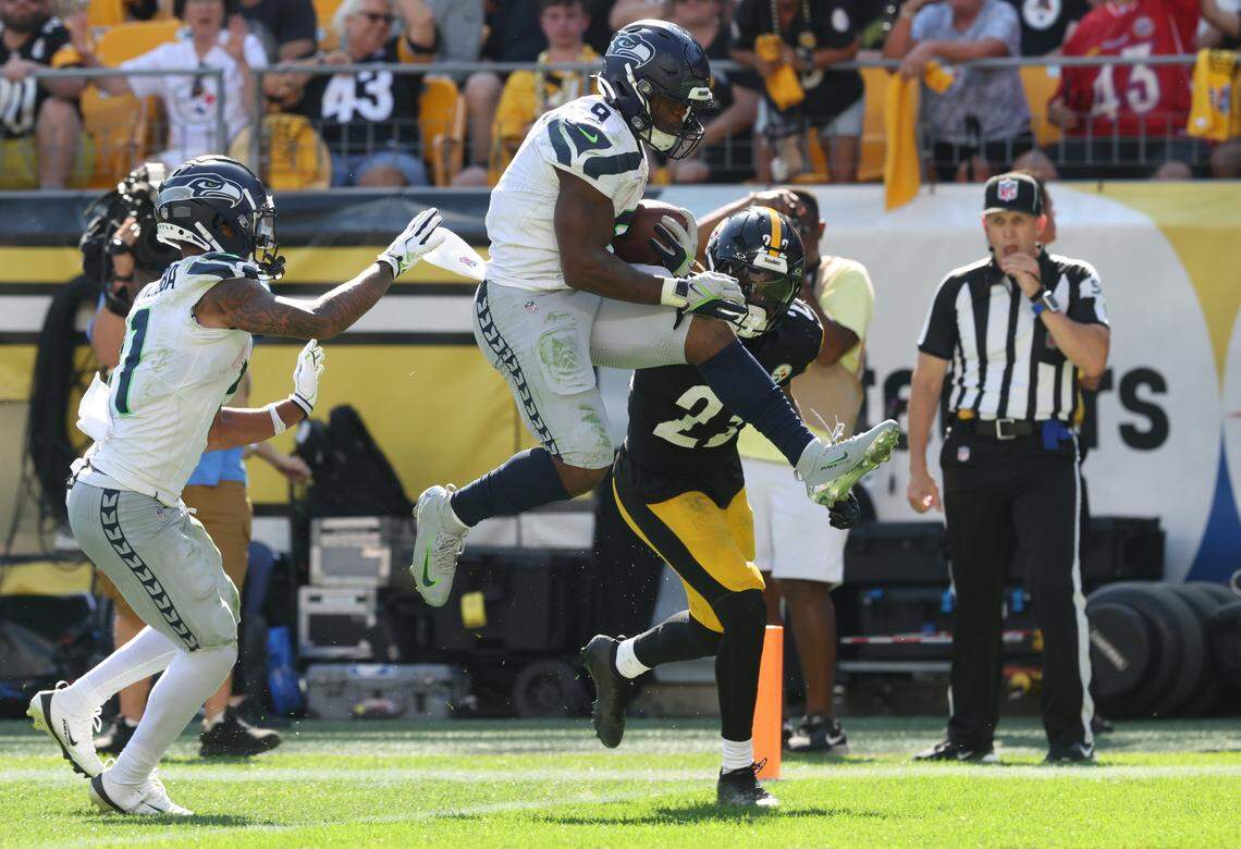 Sep 14, 2025; Pittsburgh, Pennsylvania, USA; Seattle Seahawks running back Kenneth Walker III (9) leaps into the end-zone to score a touchdown against the Pittsburgh Steelers during the fourth quarter at Acrisure Stadium. Mandatory Credit: Charles LeClaire-Imagn Images