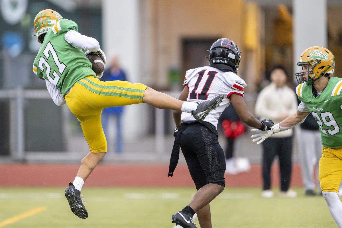 Tumwater defensive back Ethan Bello (27) catches a pass intended for Franklin Pierce wide receiver Anthony Lomiga (11) on Saturday, Nov. 22, 2025, in Tumwater.