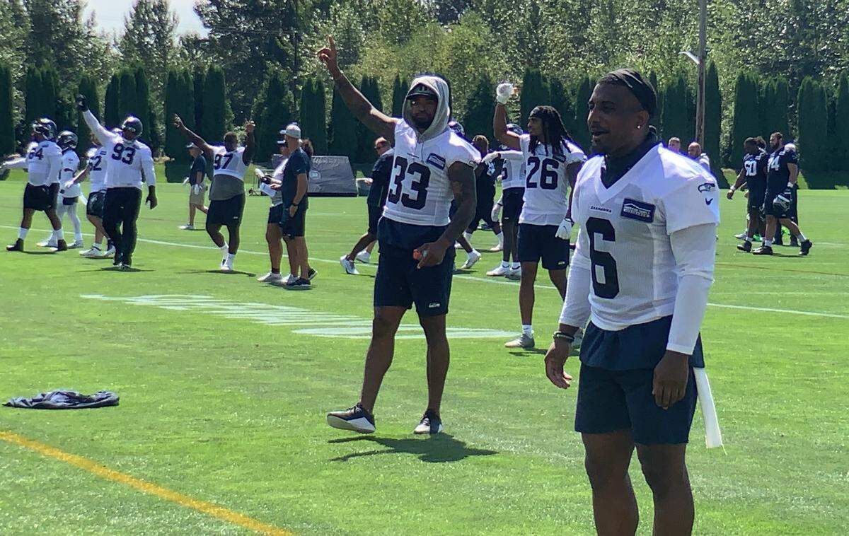 Jamal Adams (33) waves to fans after the first practice of Seahawks training camp ended Wednesday at team headquarters in Renton. The All-Pro safety wants a new contract beyond his that ends with the 2021 season. Coach Pete Carroll said Wednesday a new deal may be “very soon.”