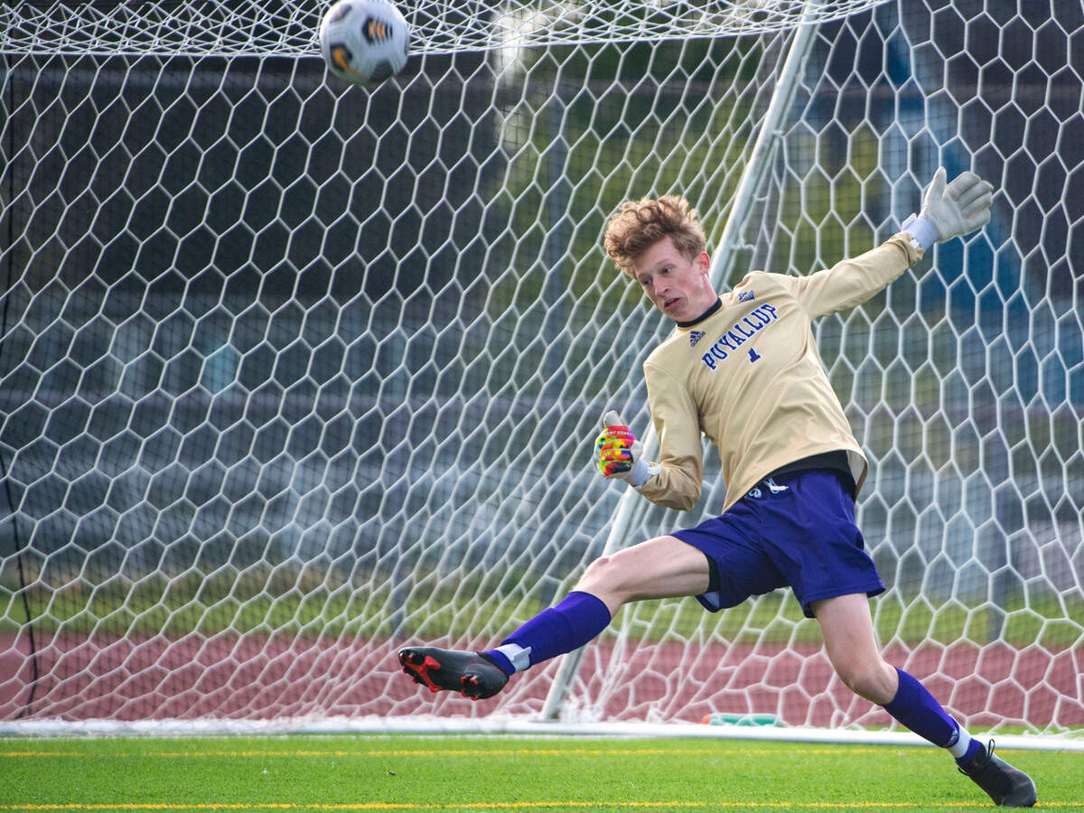 Puyallup keeper Nathan Vitzthum makes a kick save on a point-blank shot by Union’s Garik Shevchuk during the second half of the 4A District 3/4 championship game on Thursday, May 12, 2022, at Sparks Stadium in Puyallup, Wash.