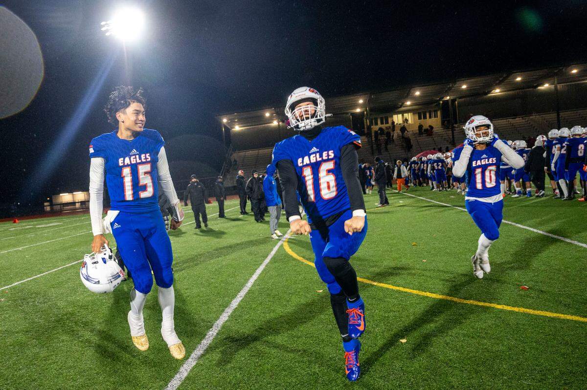 Graham-Kapowsin players celebrate in front of the home stands after beating Mount Si, 35-14, in a Week 10 playoff game on Friday, Nov. 4, 2022, at Art Crate Field in Spanaway, Wash. The win propelled the Eagles to the State 4A Playoffs which begin next week.