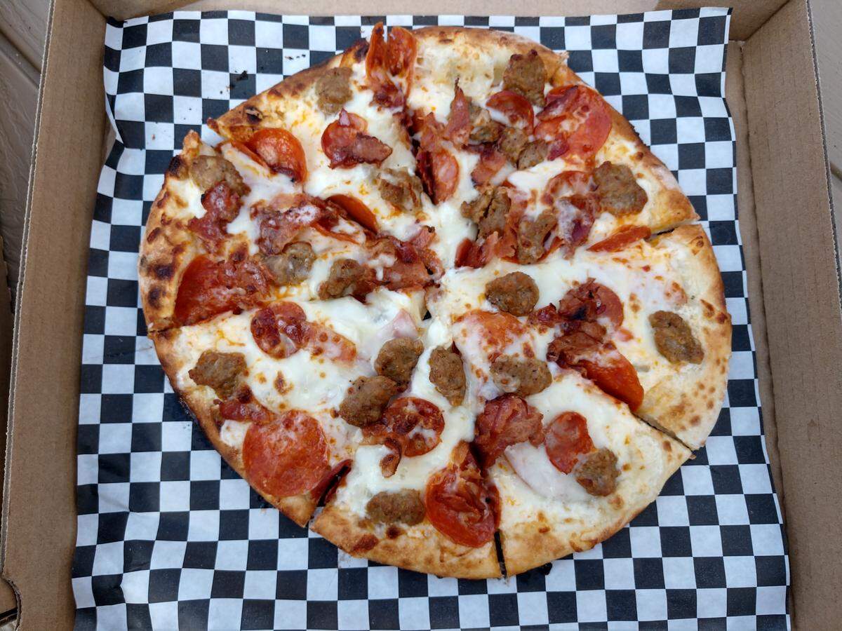 The Fat Zach pizza with five kinds of pork for toppings.