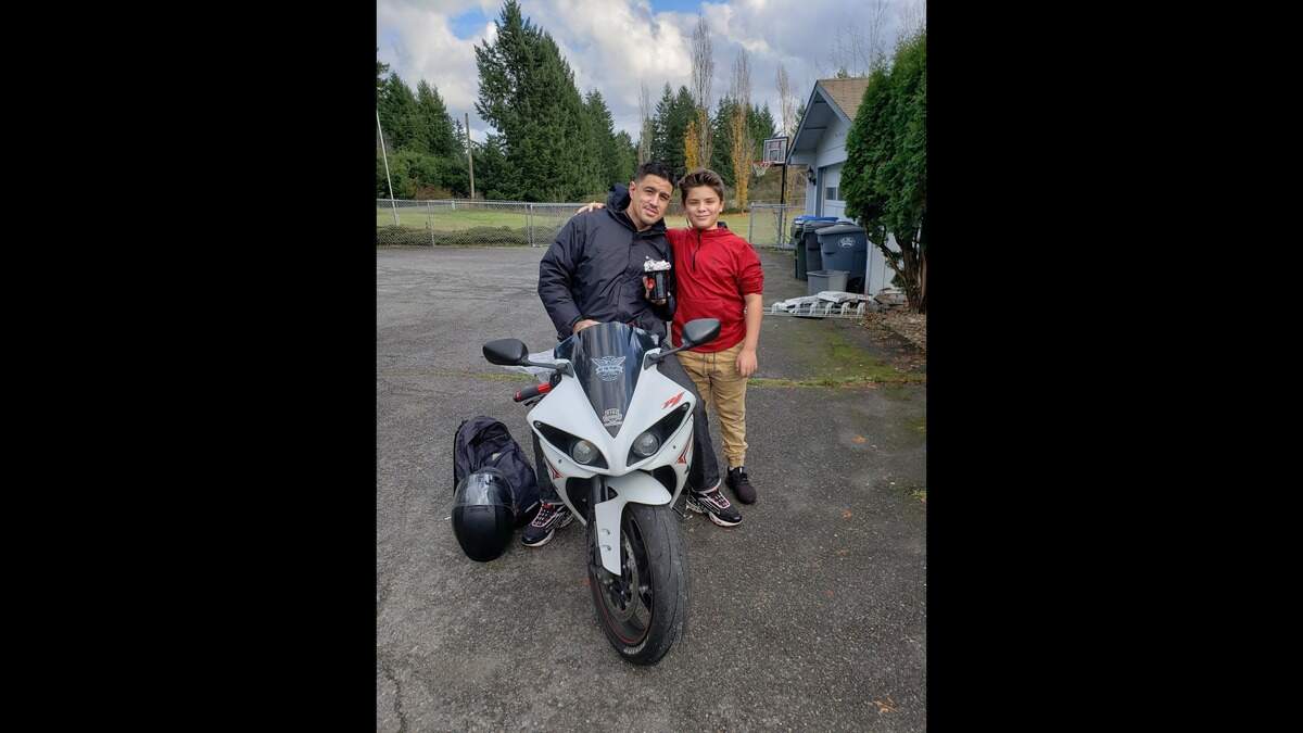 Alejandro Lloret (left) and his son, Jandro, pose for a photograph in November 2020. Lloret was shot and killed June 26, 2022, during a gunfight in the backyard of an Eastside Tacoma home.