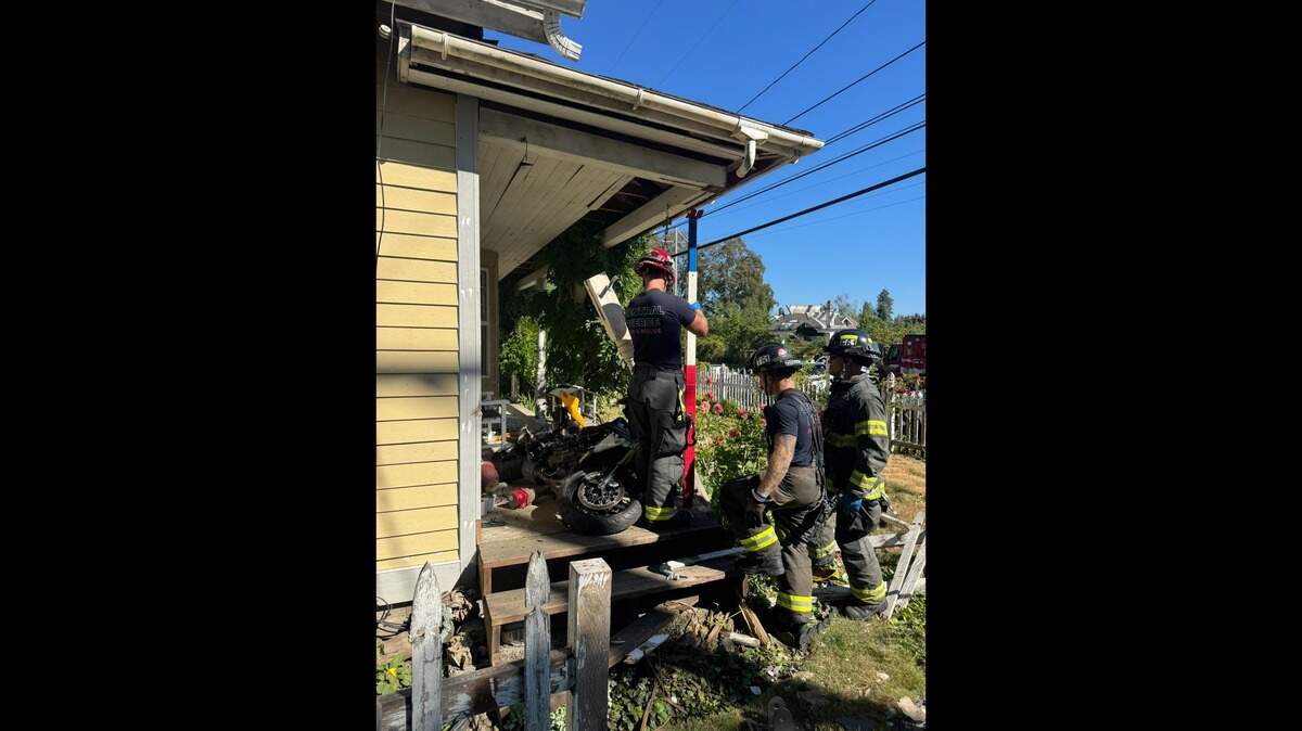 A motorcycle crashed into a house Thursday, Aug. 21, 2025, near Midland in Pierce County, Wash. The motorcyclist was transported to a local hospital.