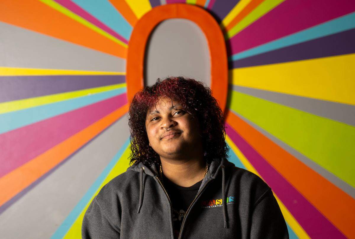 Mystix Flamer, who is a leader and mentor and advocates for youth voices, poses for a portrait at Oasis Youth Center, on Wednesday, Feb. 26, 2025, in Tacoma.