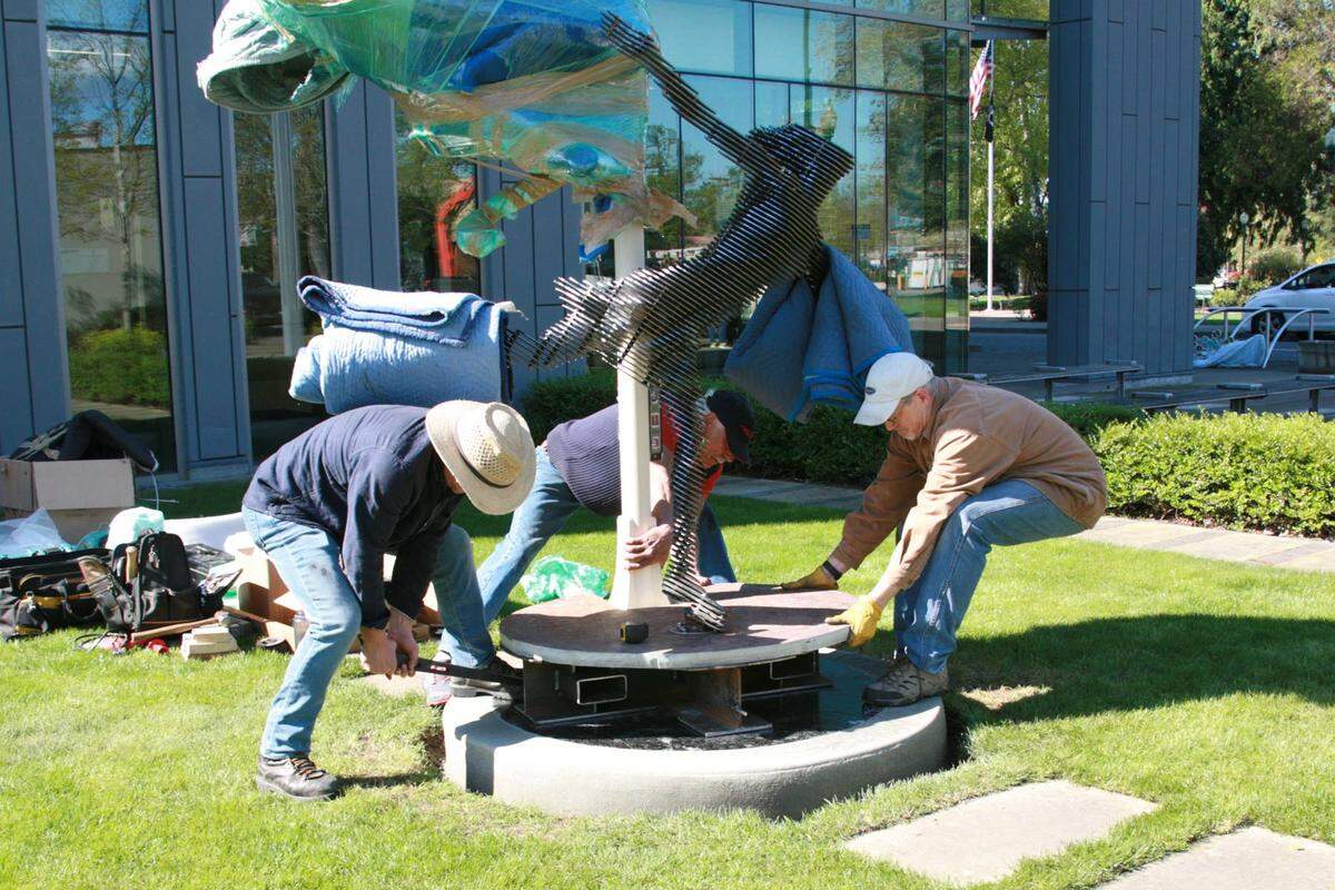 A dancer makes Puyallup her stage in “Symbiosis,” a steel statue made by Eugene, Oregon artists Mark Andrew and Randy Ortiz.