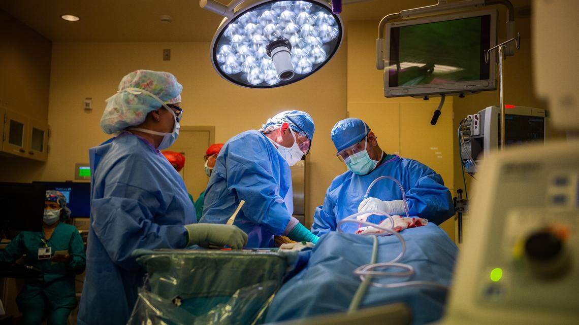 Dr. David Coons, D.O., an orthopedic surgeon, center, performs a reverse shoulder joint replacement surgery at MultiCare Allenmore Hospital in Tacoma earlier this year. The health system remains the largest private employer in Pierce County.