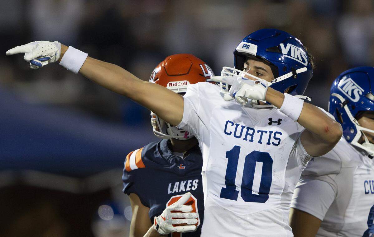 Curtis wide receiver Taylor Smith (10) reacts to a first-down catch against the Lakes Lancers during the first half of the game at Harry Lang Stadium, on Friday, Sept. 19, 2025, in Lakewood, Wash.