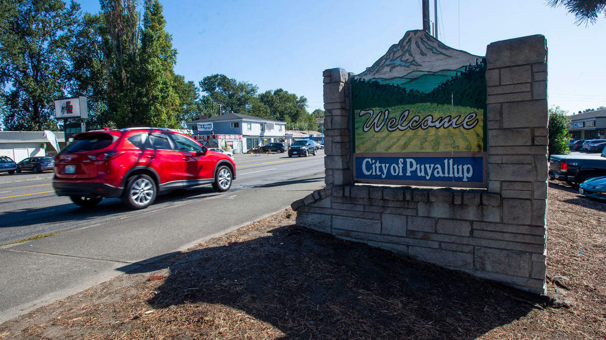 One of the current Puyallup welcome signs located on River Road Thursday, Sept, 16, 2021. A new proposed design is drawing negative feedback from residents.