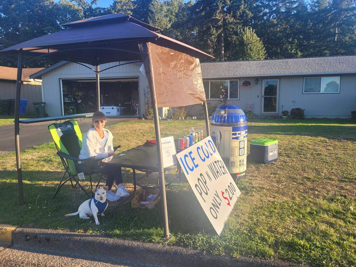 Trisha Spry parks cars at her home at 614 11th Ave. SE during the 2024 Washington State Fair in Puyallup.