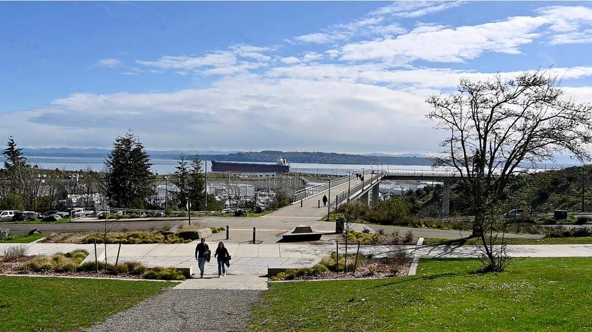 Parks Tacoma capital improvement program manager Terry Jungman and Marty Stump, director of business, administration and planning outline the upcoming 1.6-mile paved pathway project in Point Defiance Park During a March 27, 2025 tour.The second phase for the Loop Trail will connect from Wilson Way Bridge, shown here, to numerous main public areas in the park while improving pedestrian safety.