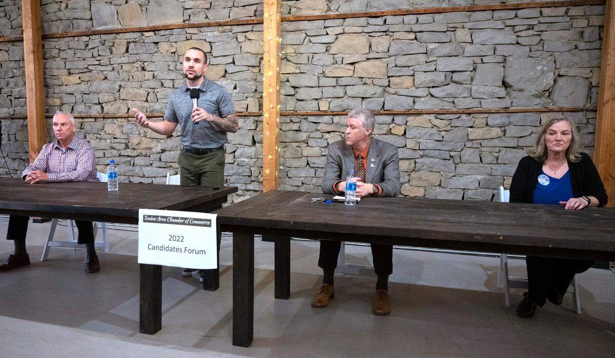 Thurston County Sheriff candidates John Snaza (from left), and Derek Sanders, and Thurston County Commissioner candidates Tye Menser and Vivian Eason during the Tenino Area Chamber of Commerce candidates forum at the Kodiak Room in Tenino, Washington, Thursday, Oct. 19, 2022.