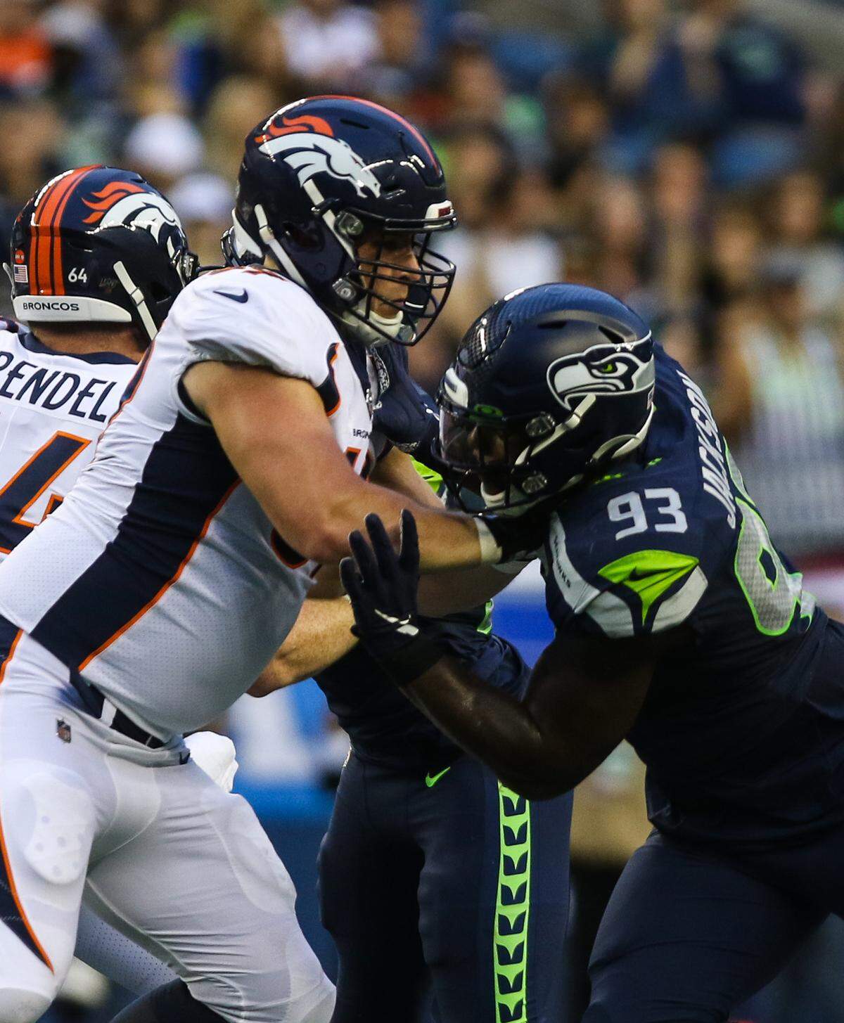 Seattle Seahawk defensive end Branden Jackson attempts to push past a Denver Bronco lineman during the first half of the preseason game Aug. 8, 2019. The Seahawks won 22-14. By Siandhara Bonnet