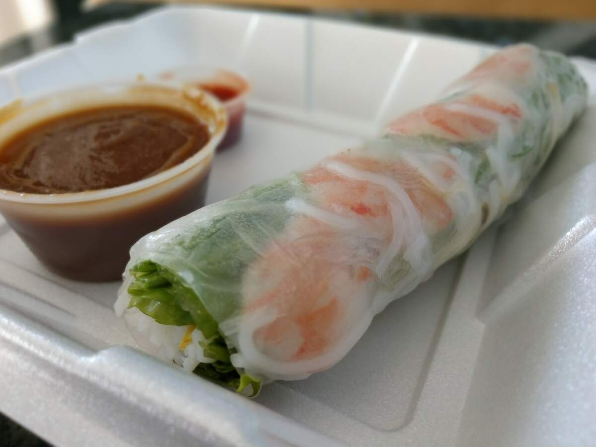 A fresh roll with noodles, fresh herbs, shrimp and sides of peanut sauce and chile paste from Souper Pho in Tacoma.
