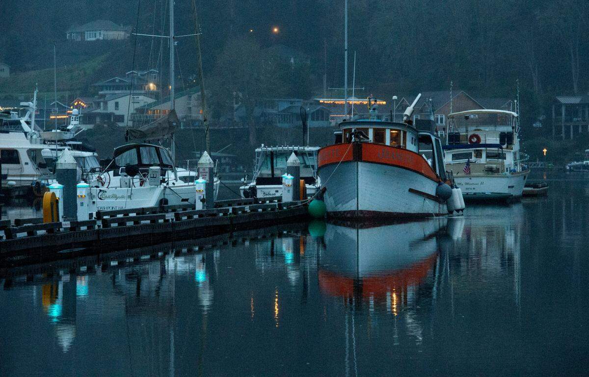 High water caused by a King Tide nearly laps over Jerisich Dock in Gig Harbor on Jan. 15, 2021.