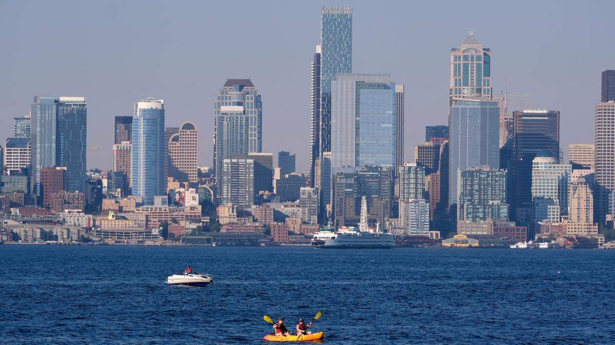 Kayakers and boaters ply the waters of Elliott Bay with the Seattle skyline behind during a heat wave hitting the Pacific Northwest, Sunday, June 27, 2021. King County grew by 0.3% in 2023 according to new Census Bureau population estimates.