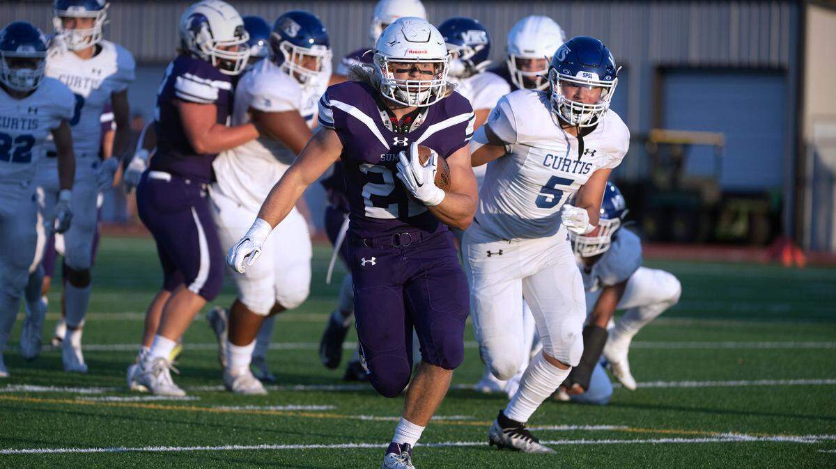 Sumner running back Matthew Spurbeck breaks loose in front of Curtis defender Micah Yanos (5) during Friday night’s football game at Sunset Chevy Stadium in Sumner, Washington, on Sept. 8, 2023. Curtis won the game, 38-33.