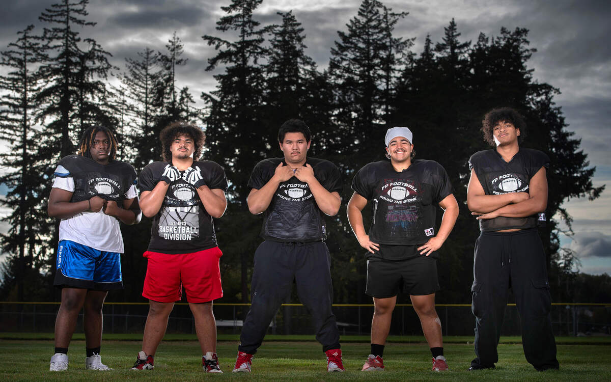 Franklin Pierce offensive linemen (from left) Jamal Abbott, Anthony Aloisio, Ian Swaney, Anton Aliosio and Tevita Aholelei are clearing space for the Cardinals old-fashioned Power T offense. They are shown at Franklin Pierce High School in Tacoma, Washington, on Tuesday, Oct. 8, 2024.