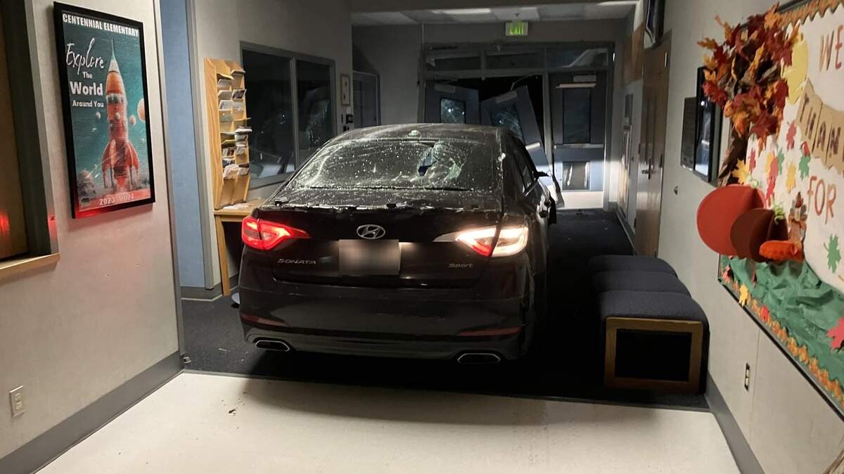 The doors of Centennial Elementary School were wrecked after the driver of a stolen car crashed the vehicle into the school on Nov. 21, 2024.