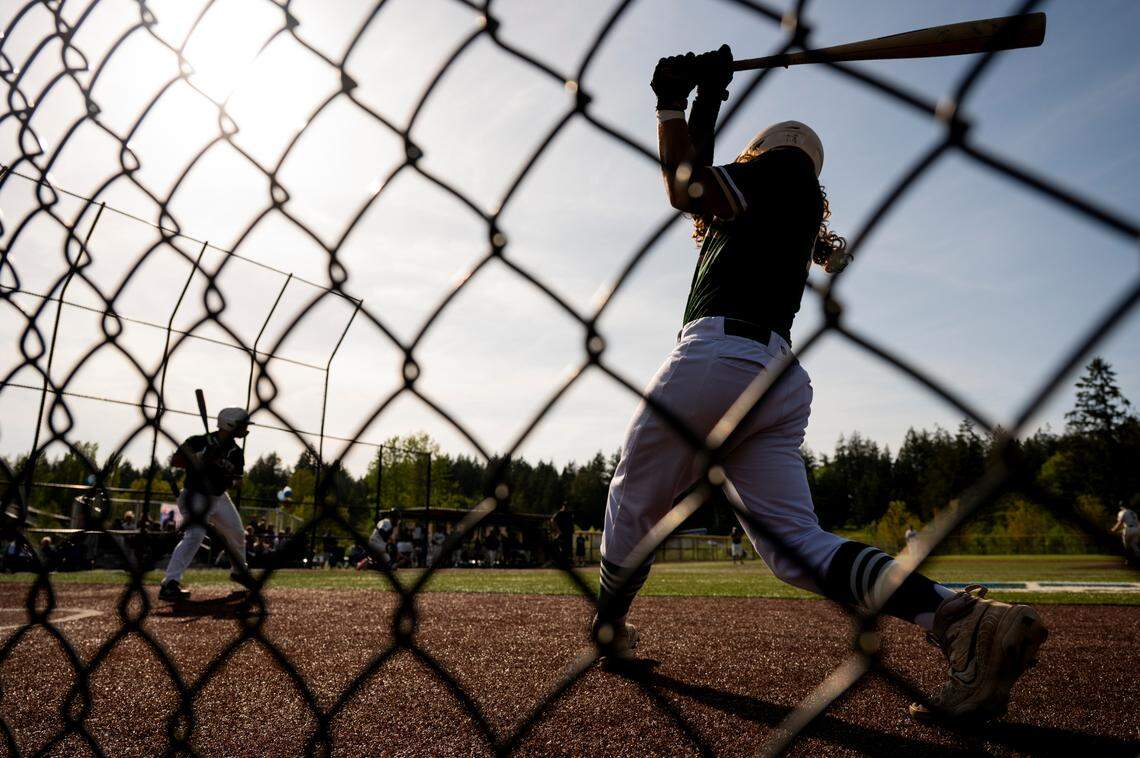 Timberline batters warm up before batting against Gig Harbor during the baseball game at Sehmel Homestead Park, on Wednesday, April 30, 2025, in Gig Harbor, Wash.