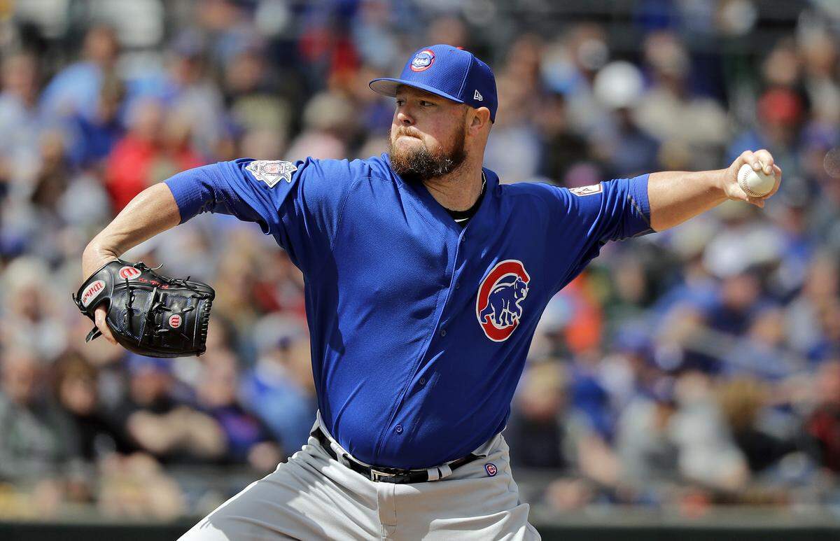 Chicago Cubs starting pitcher Jon Lester throws against the Oakland Athletics in the first inning of a spring training baseball game Wednesday, March 13, 2019, in Mesa, Ariz. (AP Photo/Elaine Thompson)