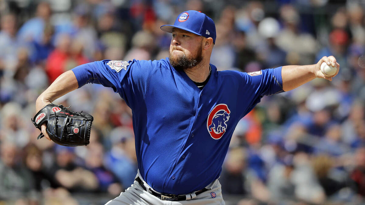 Chicago Cubs starting pitcher Jon Lester throws against the Oakland Athletics in the first inning of a spring training baseball game Wednesday, March 13, 2019, in Mesa, Ariz. (AP Photo/Elaine Thompson)