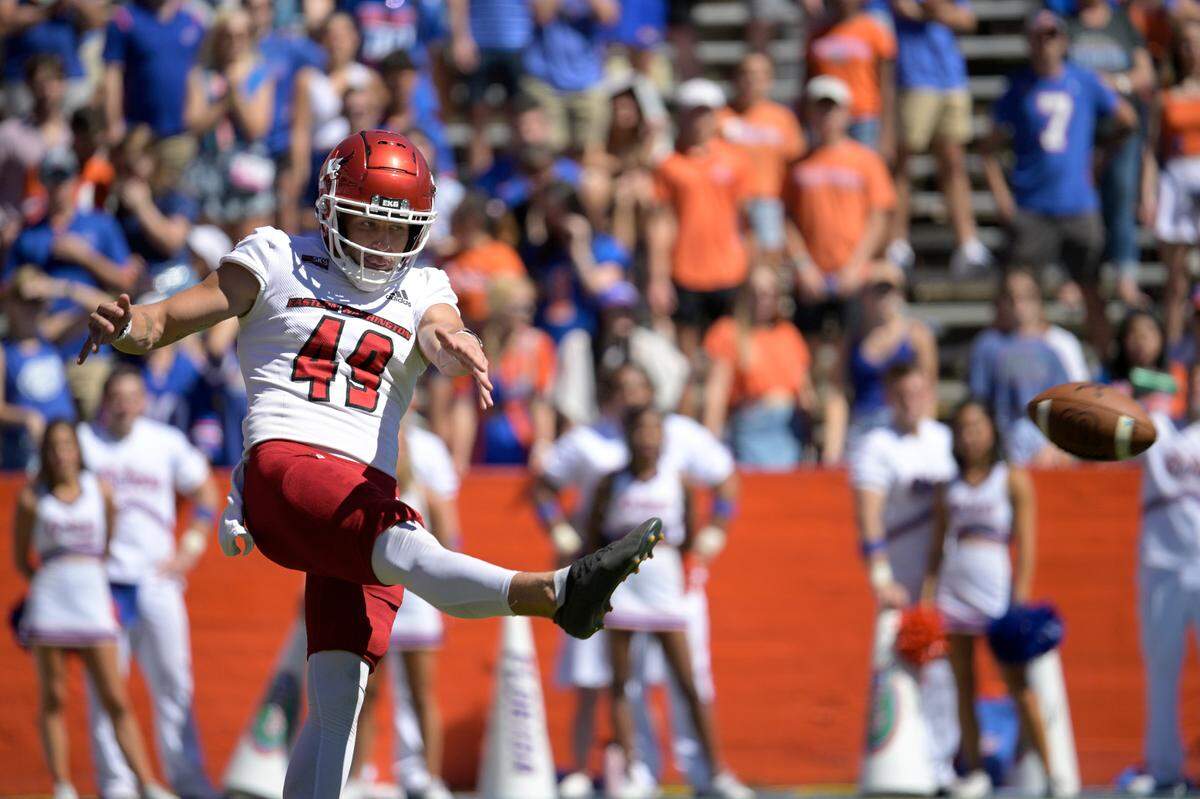 Eastern Washington punter Nick Kokich (49) punts the ball during the second half of an NCAA college football game against Florida, Sunday, Oct. 2, 2022, in Gainesville, Fla. (AP Photo/Phelan M. Ebenhack)