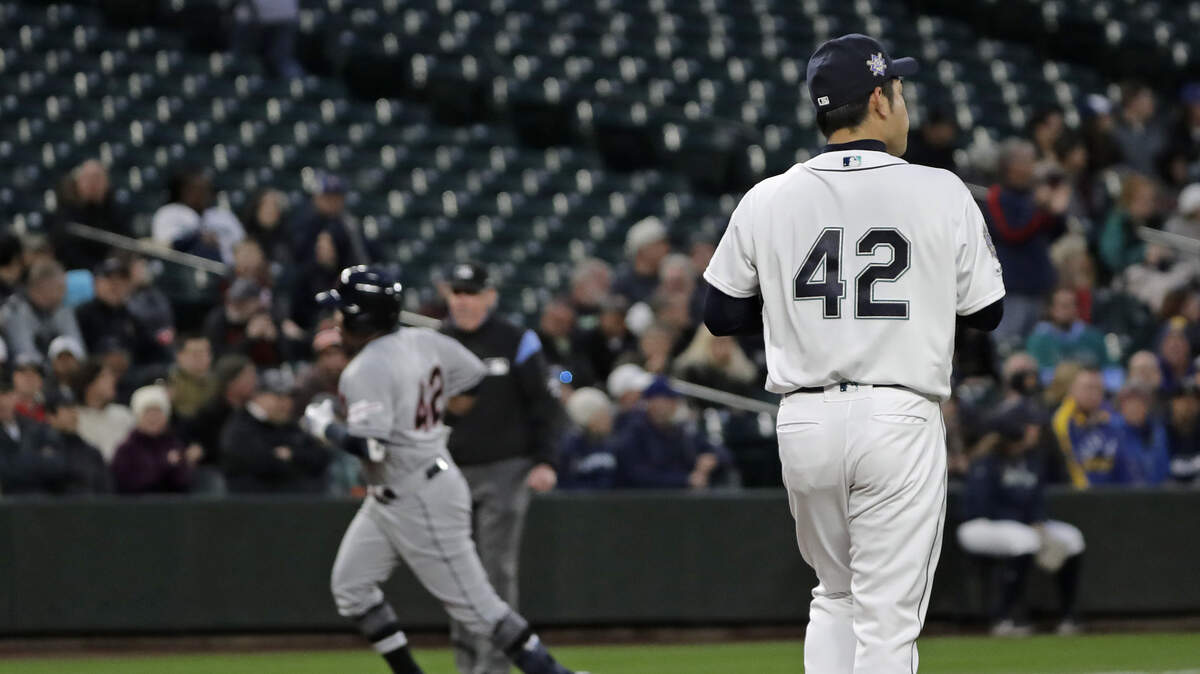 Seattle Mariners starting pitcher Yusei Kikuchi, right, watches as Cleveland Indians’ Jose Ramirez, left, rounds the bases after Ramirez hit a solo home run during the third inning of a baseball game, Monday, April 15, 2019, in Seattle. (AP Photo/Ted S. Warren)