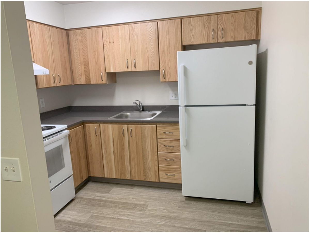 Outdated kitchen inside existing Tacoma Housing Authority unit.