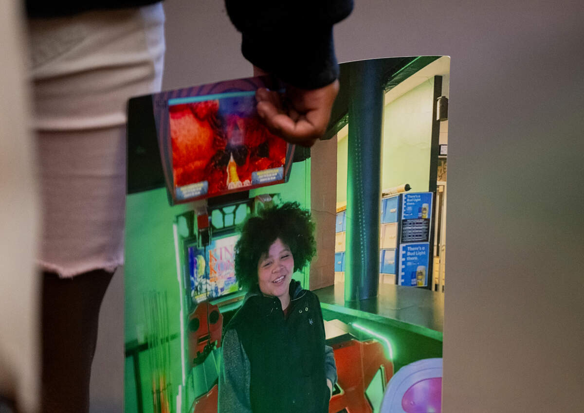 Little sister of Xaviar Siess holds a photo of him during the sentencing of William Kalama, 19, for second-degree murder and third-degree assault of her brother. Photographed at Pierce County Superior Court, on Thursday, Nov. 7, 2024 in Tacoma.