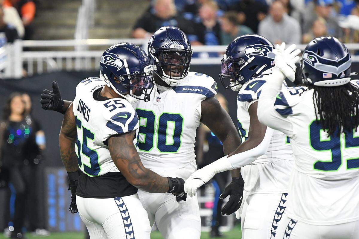 Seattle Seahawks defensive tackle Jarran Reed (90) celebrates with teammates after recording a sack against the Detroit Lions in the first quarter at Ford Field, in Detroit, Mich. Mandatory Credit: Eamon Horwedel-Imagn Images