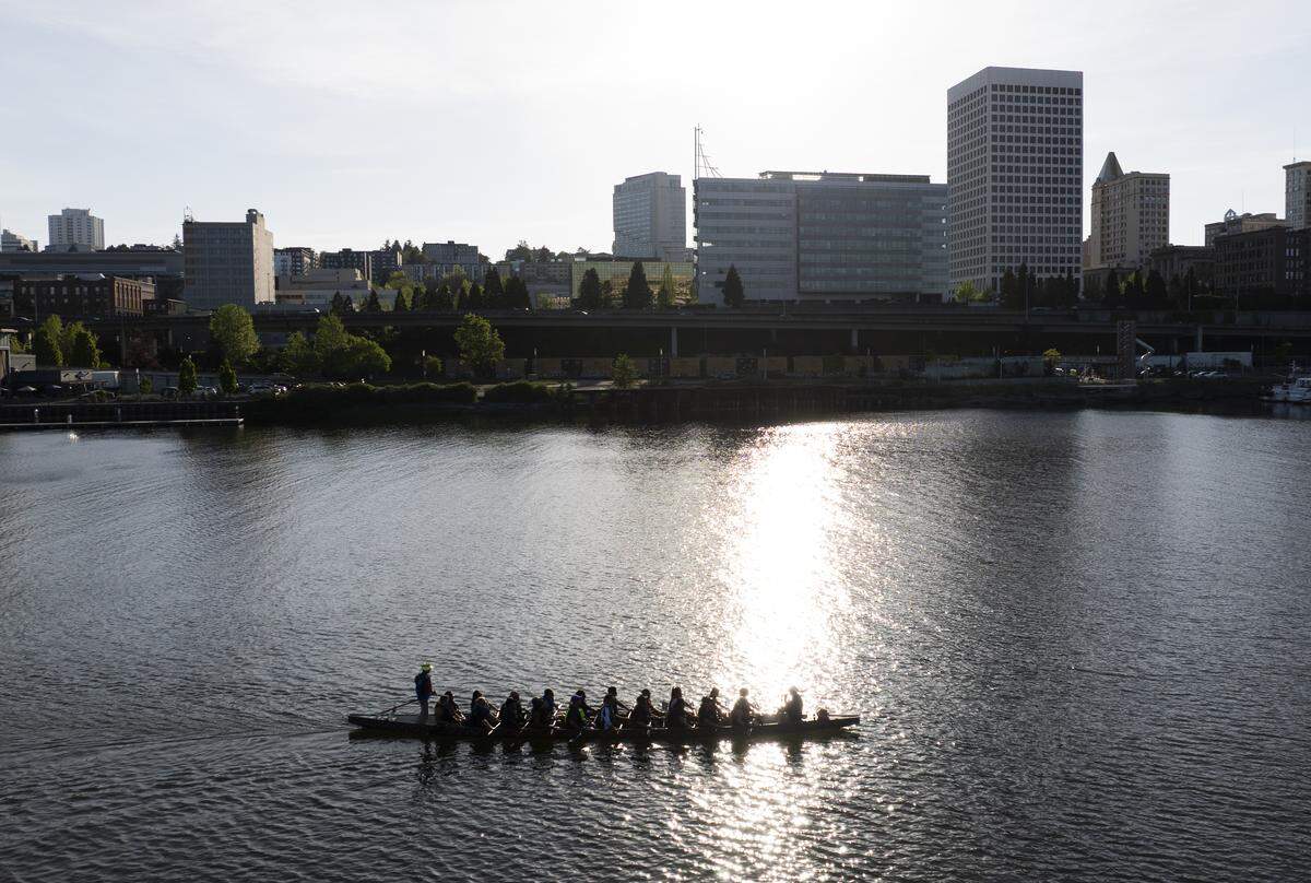People paddle in a dragon boat in the Thea Foss Waterway during a practice, on Monday, May 4, 2026, in Tacoma. 
