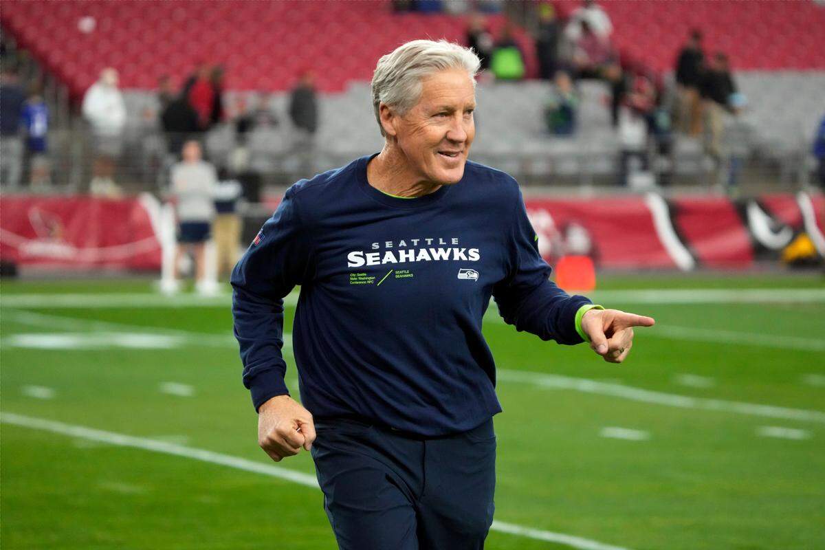 Seattle Seahawks head coach Pete Carroll watches as players warm up before an NFL football game against the Arizona Cardinals Sunday, Jan. 7, 2024, in Glendale, Ariz. (AP Photo/ Rick Scuteri)