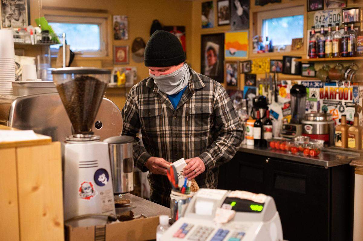 Seth Cornell, owner of Greenwater Outfitters, makes a coffee inside the cafe on Friday, Oct. 23, 2020.