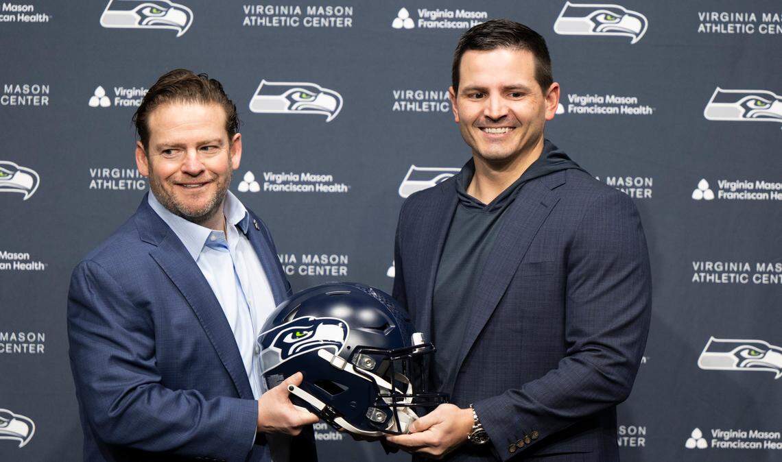 Seahawks general manager John Schneider and head coach Mike Macdonald pose during a press conference introducing Macdonald as new head coach at Virginia Mason Athletic Center on Thursday, Feb. 1, 2024, in Renton, Washington.