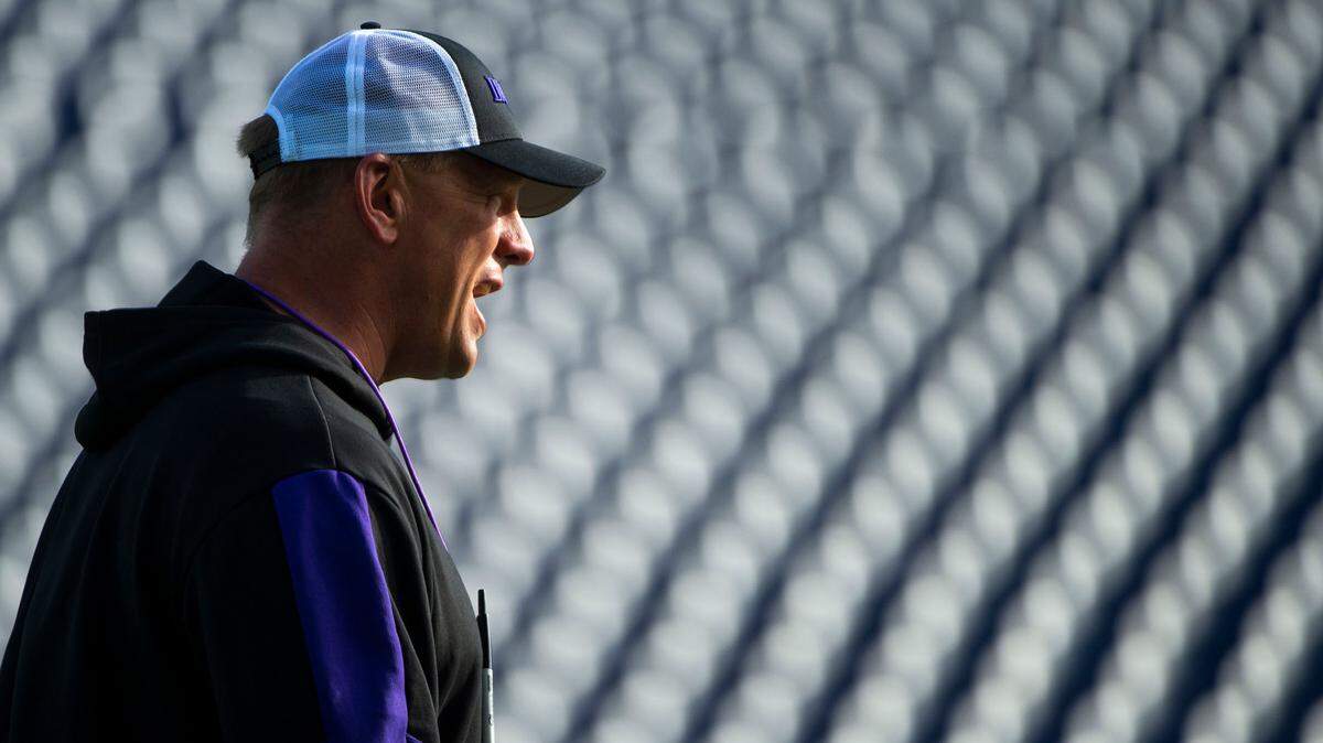 First-year Washington head coach Kalen DeBoer encourages his team during spring practice on Friday, April 8, 2022, at Husky Stadium in Seattle.