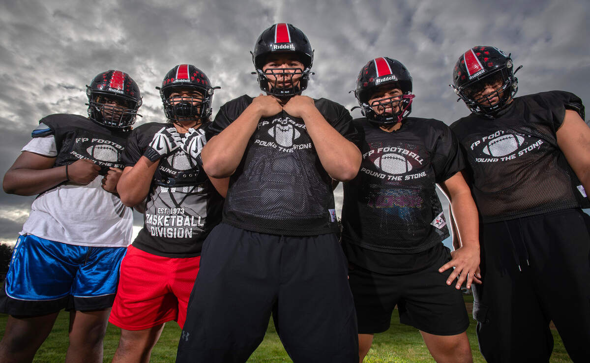 Franklin Pierce offensive linemen (from left) Jamal Abbott, Anthony Aloisio, Ian Swaney, Anton Aliosio and Tevita Aholelei are clearing space for the Cardinals old-fashioned Power T offense. They are shown at Franklin Pierce High School in Tacoma, Washington, on Tuesday, Oct. 8, 2024.