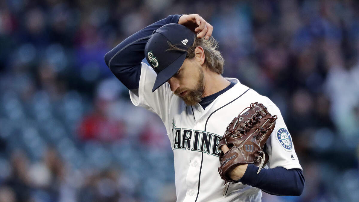 Seattle Mariners starting pitcher Mike Leake walks off the field at the end of the top of the fifth inning of a baseball game against the Texas Rangers, Saturday, April 27, 2019, in Seattle.