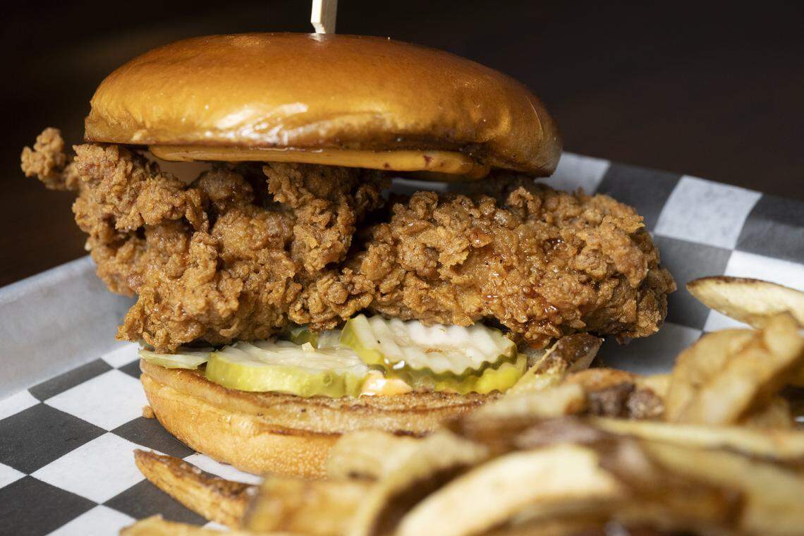 The Barn Burner fried chicken sandwich, made with pickles, hot honey and chipotle aioli and served hand-cut fries or jos, is pictured on Wednesday, Jan. 7, 2026, at Terry's Bar and Grill in Tacoma, Wash.