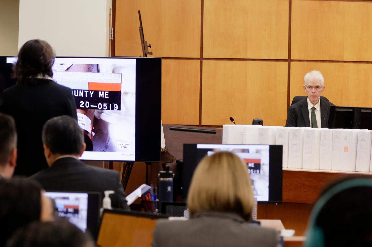 Dr. Thomas Clark, the former Pierce County medical examiner who conducted the autopsy on Manuel “Manny” Ellis, testifies during the trial of Tacoma Police officers accused in the death of Ellis held at Pierce County Superior Court, Thursday, Nov. 2, 2023, in Tacoma, Wash. Officers Christopher Burbank, Matthew Collins and Timothy Rankine are charged. (John Froschauer / Pool Photo - AP)