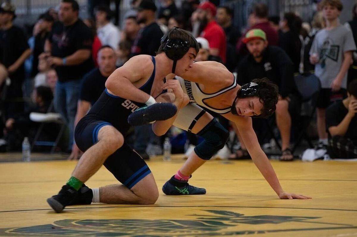 Ridgefield junior and two-time Mat Classic champion Mason DesRochers (left) was selected to The News Tribune’s 2026 Class of Untouchables.