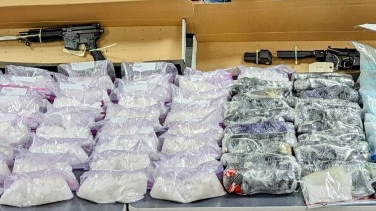 Some of the drugs and guns confiscated during an arrest Feb. 16 of an alleged narcotics trafficker based in Tacoma.