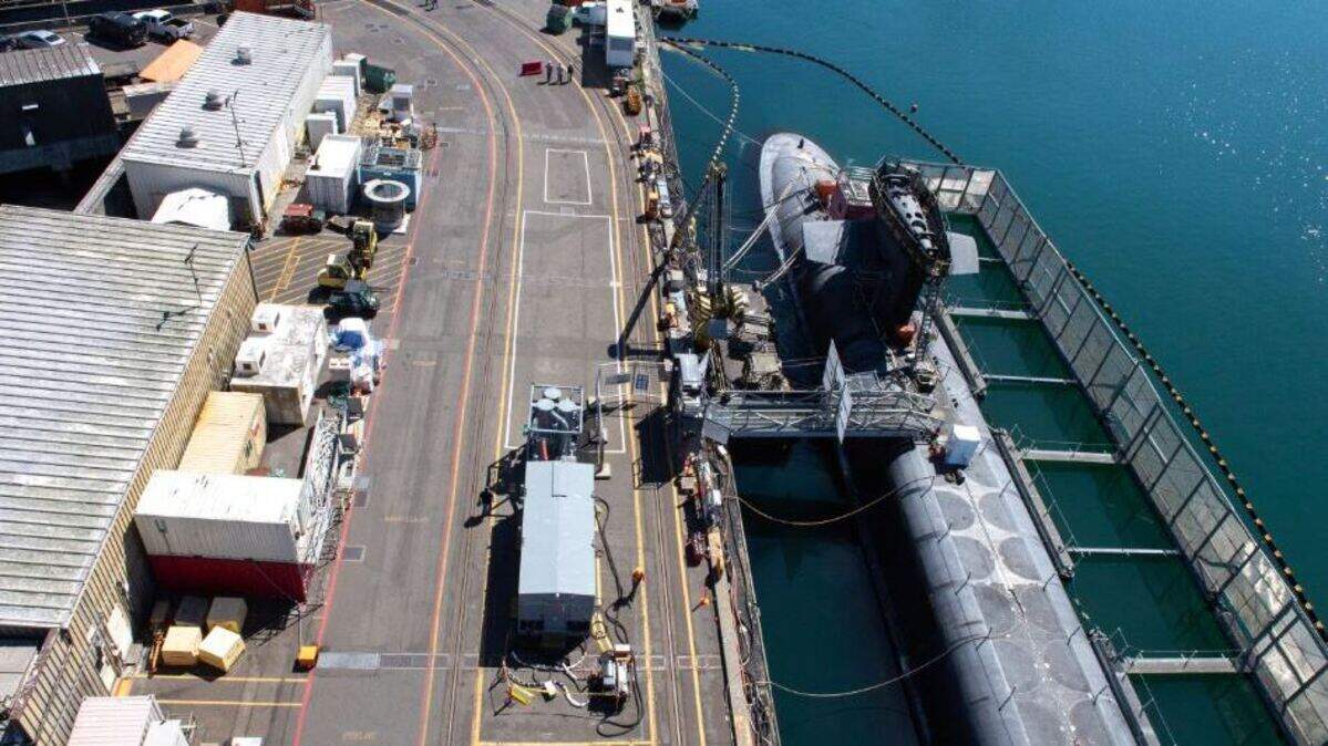 Ohio-class ballistic missile submarine USS Alabama (SSBN 731) docked in August 2022 on Naval Base Kitsap’s Delta Pier. Trident Refit Facility, Bangor’s (TRFB) core mission is repairing, incrementally overhauling, and modernizing the Pacific Fleet’s ballistic missile submarine force.
