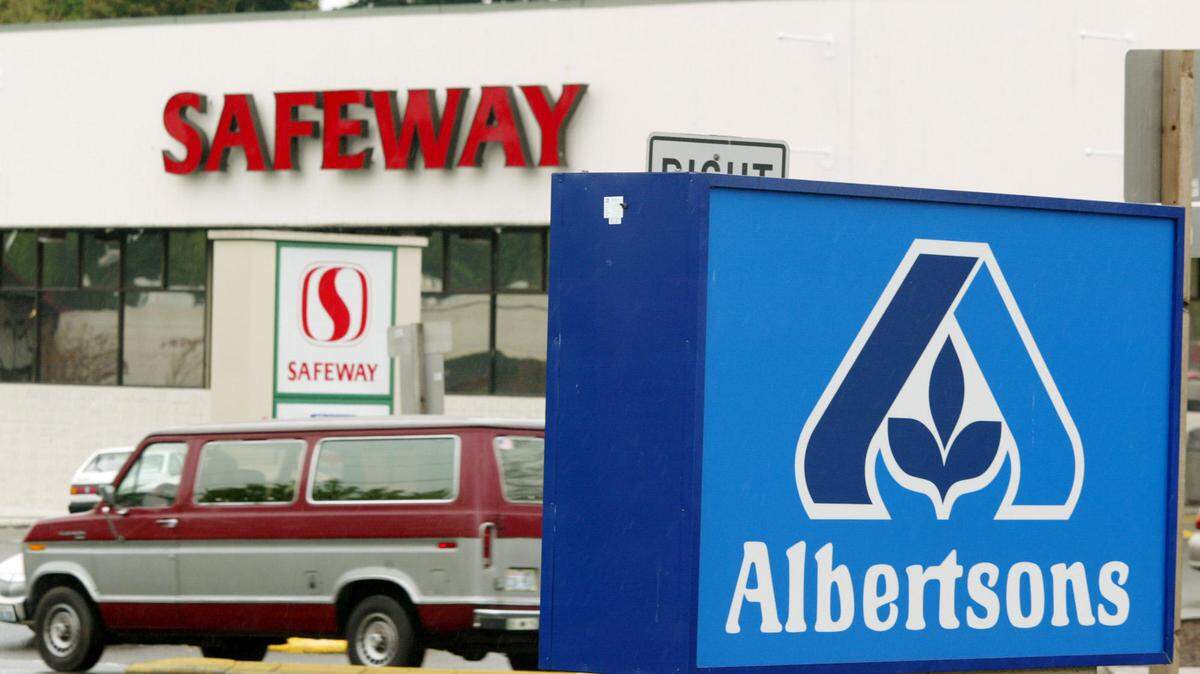 Albertsons and Safeway grocery stores seen near each other in Federal Way in 2003. Store locations might face a reshuffling if a proposed Kroger-Albertsons merger is approved.