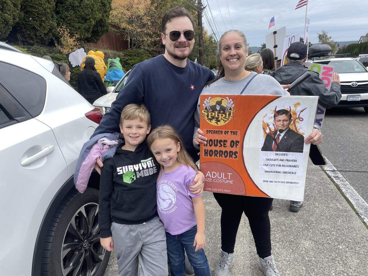 Tacoma couple Ryan and Sarah Mulligan took their two young children to the No Kings protest at Point Defiance on Oct. 18, 2025.