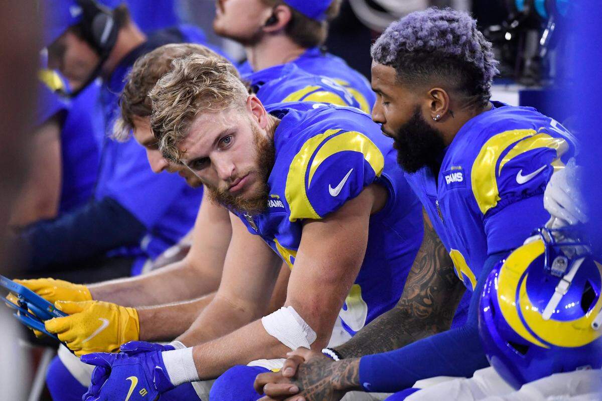 Los Angeles Rams wide receiver Cooper Kupp, center, talks to wide receiver Odell Beckham Jr., right, during the second half of an NFL football game against the Seattle Seahawks Tuesday, Dec. 21, 2021, in Inglewood, Calif. (AP Photo/Kevork Djansezian)